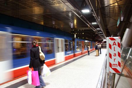 Fast Moving Train at a Railway Station