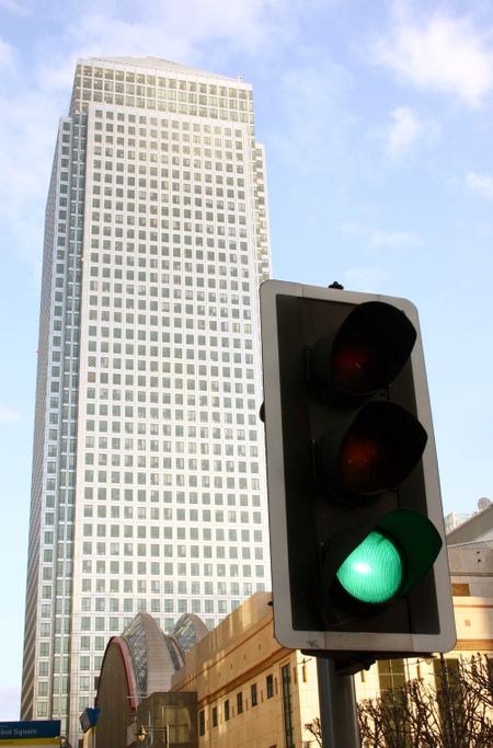 Green traffic light in a corporate district