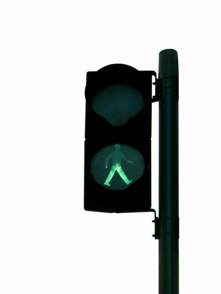 Isolated Green Man in traffic light