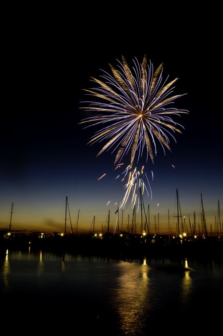 Multicolored burst of fireworks over marina in Michigan City, Indiana, USA