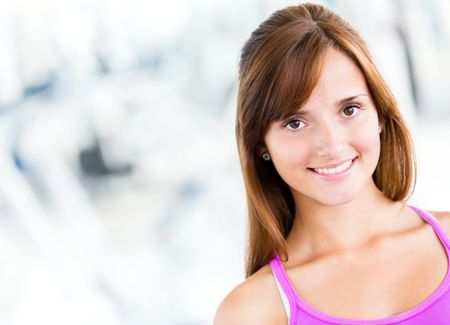 beautiful-woman-portrait-gym-smiling-109491593 Beautiful woman portrait at the gym smiling