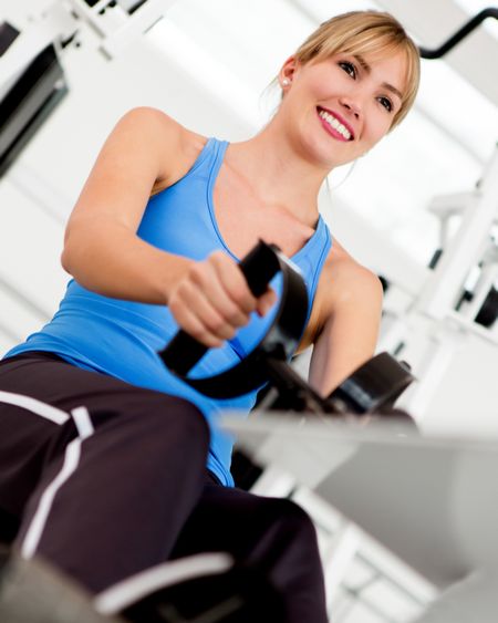 Woman at the gym exercising on a machine