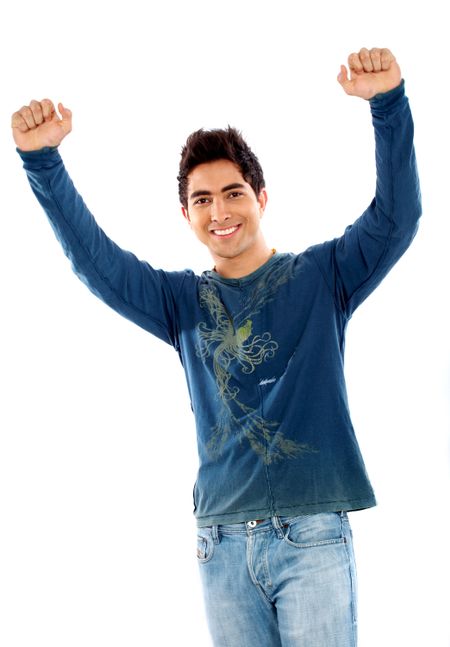 casual man looking happy with arms up isolated over a white background