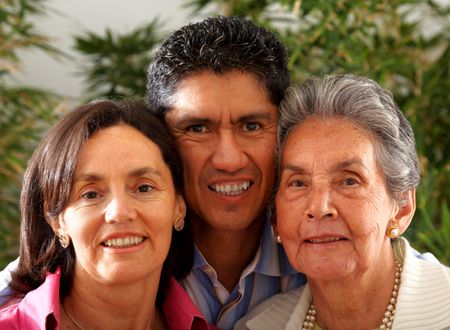 happy two generation family portrait smiling indoors