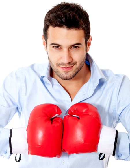 Aggressive businessman with boxing gloves - isolated over a white background