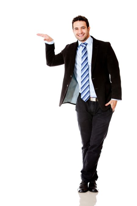 Businessman with hand on something imaginary - isolated over white