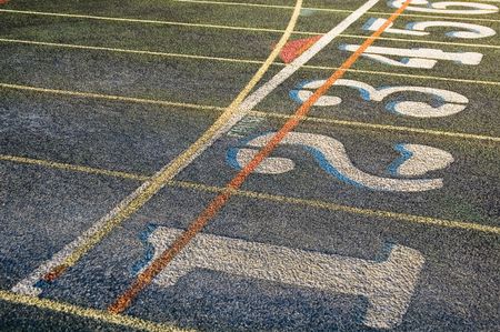 Lanes one through six of weathered running track