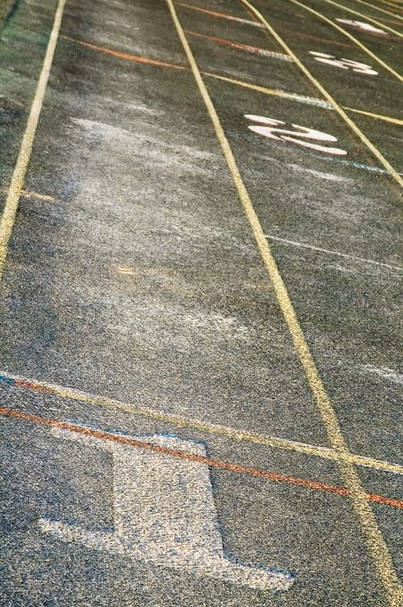 Staggered lanes of weather running track
