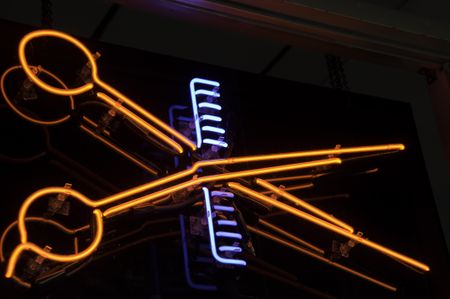 Neon light in window of barber shop