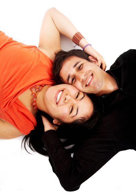 happy couple on the floor isolated over a white background