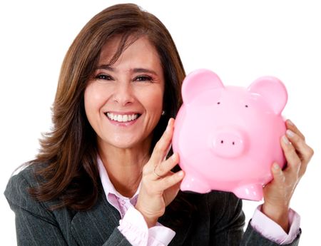 Happy businesswoman with her savings in a piggybank - isolated