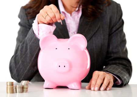 Business woman saving money in a piggybank - isolated