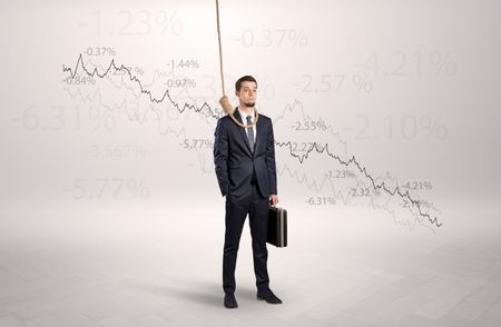 Desperate young businessman with decreasing bankruptcy concept