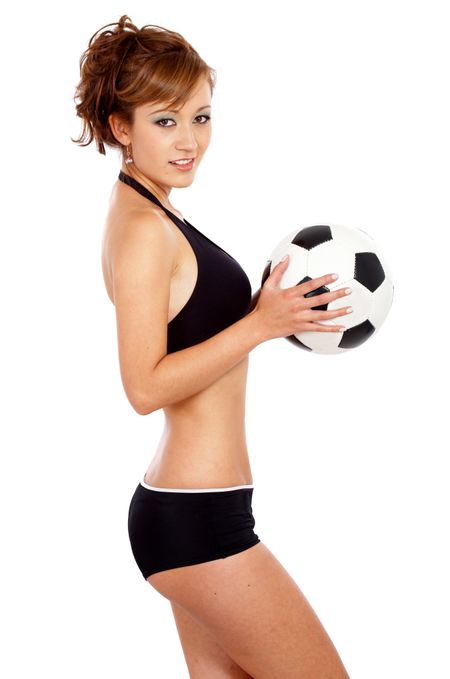fashion girl with a football isolated over a white background