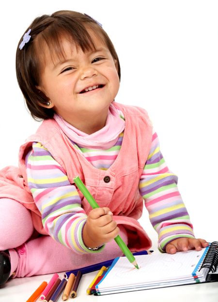 girl colouring on a notebook isolated over a white background
