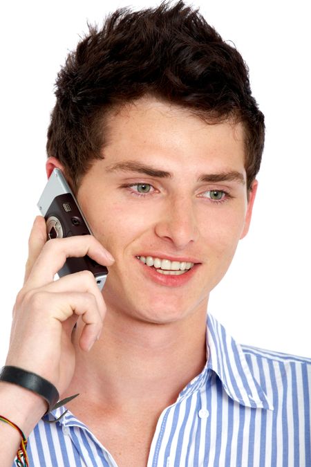 casual man smiling and talking on a mobile phone isolated over a white background