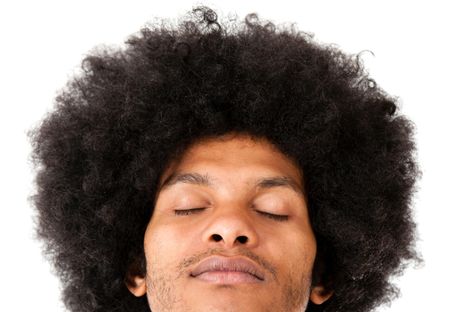 Afro man with eyes closed - isolated over a white background