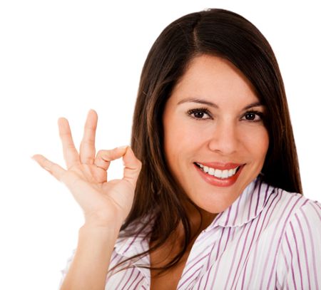 Woman with an ok sign - isolated over a white background