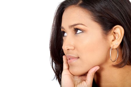 pensive woman smiling isolated over a white background