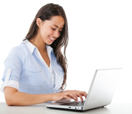 Woman working on a laptop computer- isolated over a white background