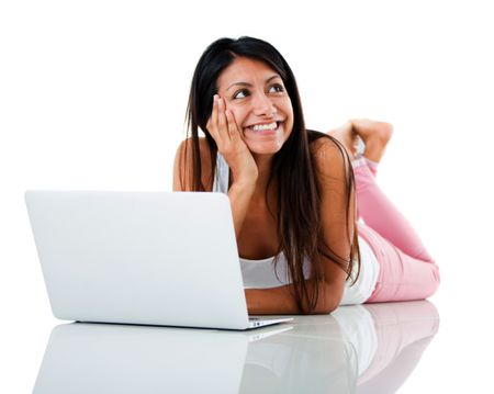 Thoughtful woman with a laptop - isolated over a white background