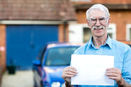 Man selling a car and holding banner