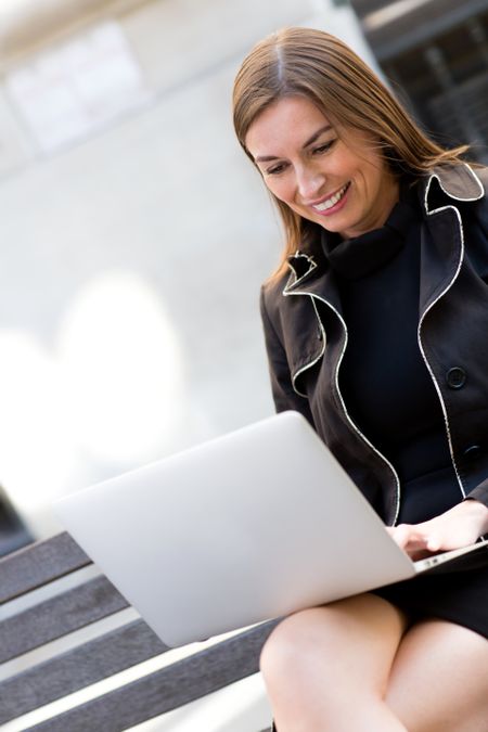 Successful business woman working on a laptop