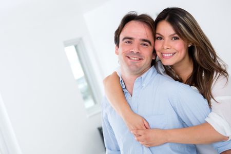 Beautiful couple at home looking very happy