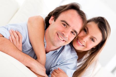 Affectionate couple at home looking very happy