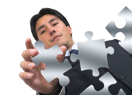 business man arranging puzzle pieces