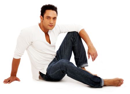casual man on the floor isolated over a white background