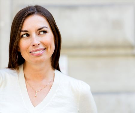 Portrait of a beautiful thoughtful woman smiling