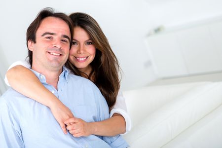 Loving couple at home looking very happy