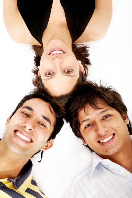 girl and two men smiling on the floor looking happy isolated over a white background