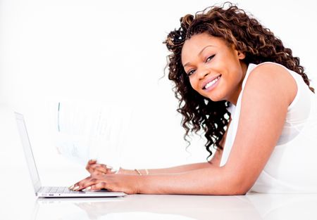 Woman paying bills online and looking happy