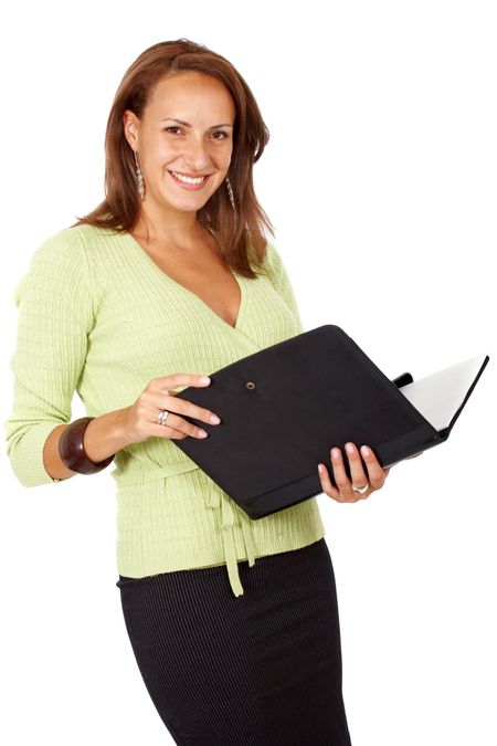 friendly business woman smiling and holding a folder - isolated over a white background