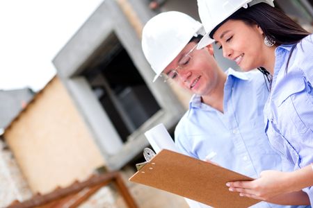 Workers in a construction site talking about a house project