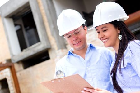 Team of architects working in a construction site