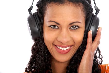 Woman listening to music isolated over a white background