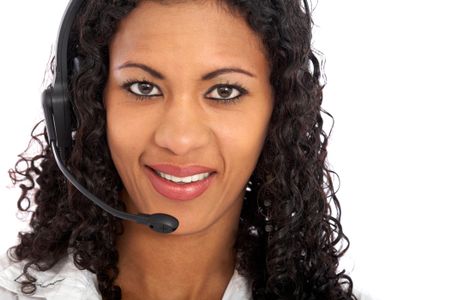 beautiful business customer service woman - smiling and wearing a headset isolated over a white background
