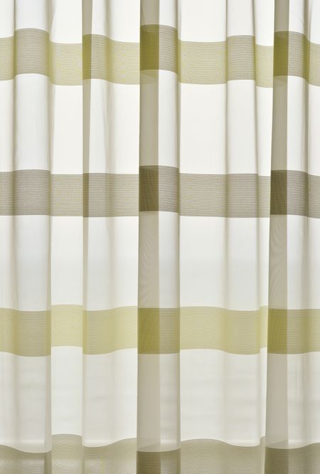 Luminous curtains in hotel room with ocean view