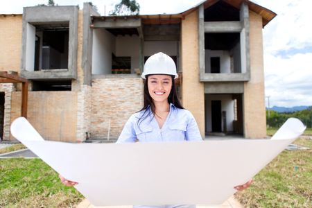 Woman looking at a house project under construction