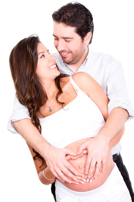 Happy couple expecting a baby - isolated over a white background