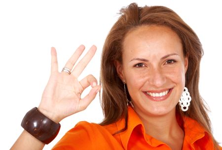 business woman doing the ok sign smiling - isolated over a white background