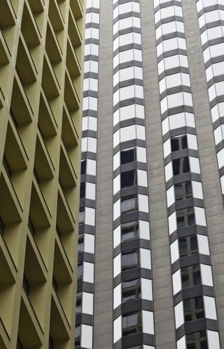 Different symmetries of two Chicago skyscrapers in proximity