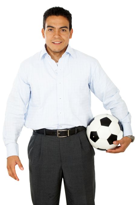 confident business man with a football isolated over a white background