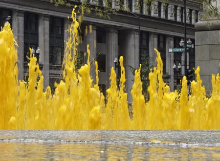 Fountains colored orange to celebrate autumn and Halloween in downtown Daley Plaza, Chicago, Illinois