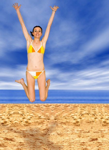 girl jumping in the beach