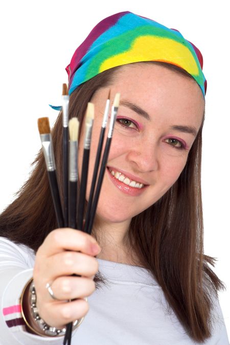 beautiful girl holding some brushes over a white background
