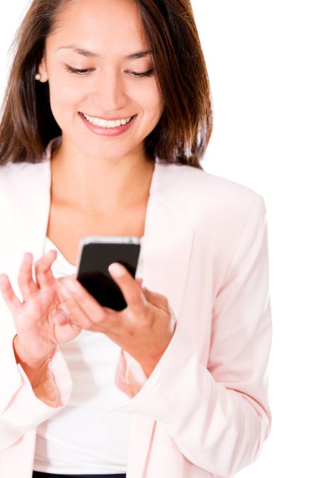 Business woman sending a text message from her phone